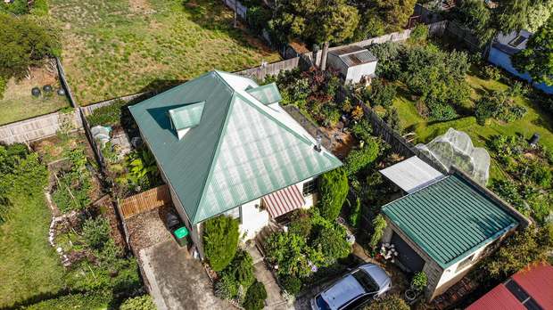 Patchy hip roof, finished in charcoal before